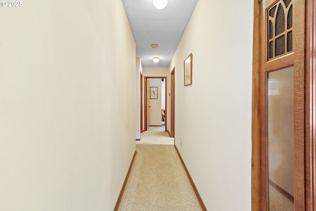 16828 Webster Rd, Gladstone, OR 97027 - corridor featuring light colored carpet and a textured ceiling
