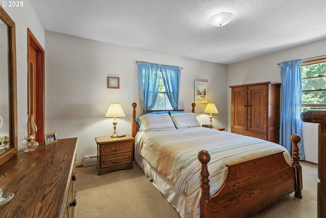 16828 Webster Rd, Gladstone, OR 97027 - carpeted bedroom featuring a textured ceiling and baseboard heating