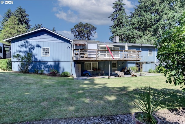 16828 Webster Rd, Gladstone, OR 97027 - back of house with a lawn, a deck, a chimney, and a patio