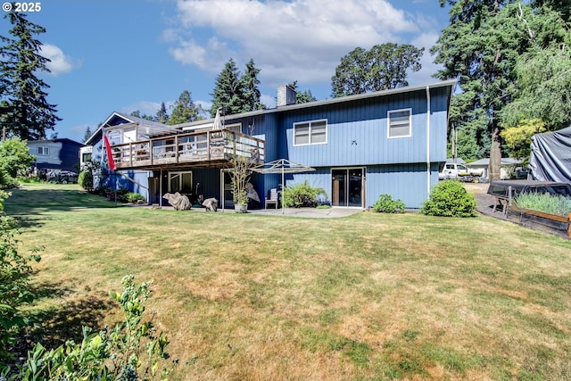 16828 Webster Rd, Gladstone, OR 97027 - rear view of property featuring a deck, a chimney, and a yard