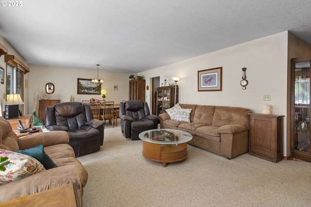 16828 Webster Rd, Gladstone, OR 97027 - living area with carpet floors, a chandelier, and a textured ceiling