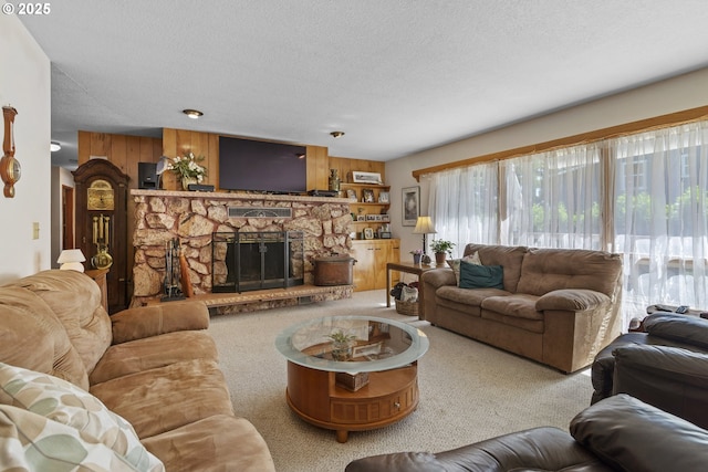 16828 Webster Rd, Gladstone, OR 97027 - carpeted living area with a textured ceiling and a stone fireplace