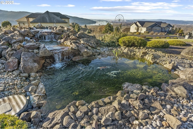 surrounding community featuring a mountain view