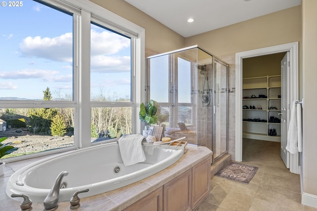 bathroom with separate shower and tub