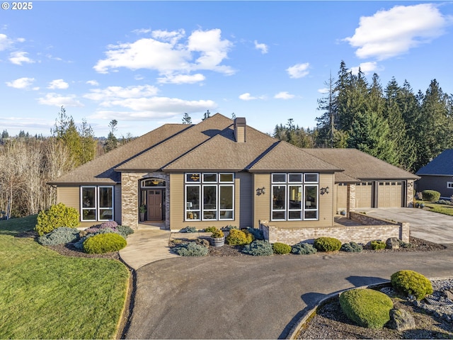 single story home with a garage and a front yard