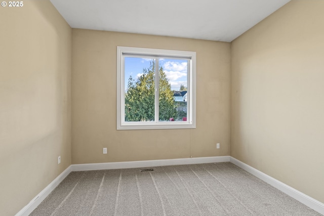 unfurnished room with carpet floors