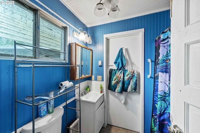 51014 Dement Creek Rd, Myrtle Point, OR 97458 - full bathroom with vanity, toilet, and speckle patterned floor