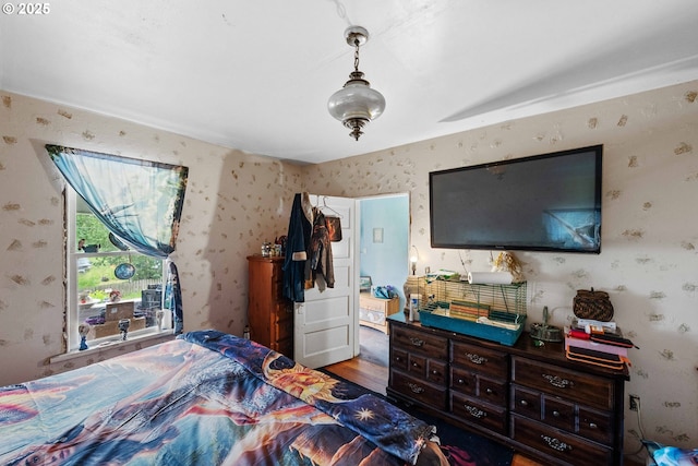 51014 Dement Creek Rd, Myrtle Point, OR 97458 - bedroom featuring wallpapered walls and wood finished floors