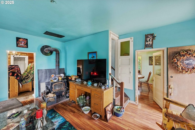 51014 Dement Creek Rd, Myrtle Point, OR 97458 - living area featuring a wood stove and wood finished floors