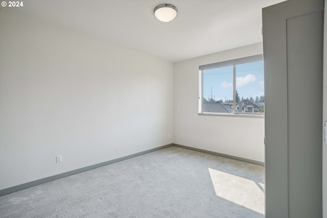 empty room with light colored carpet