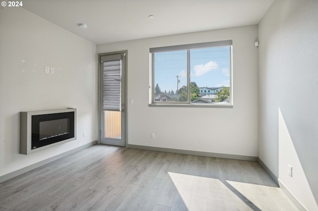 unfurnished living room with light hardwood / wood-style floors