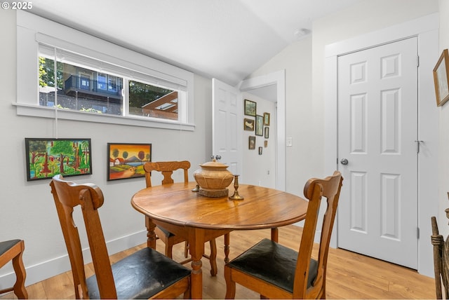 4604 SE 30th Ave, Portland, OR 97202 - dining area featuring vaulted ceiling, light wood-style floors, and baseboards
