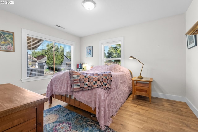 4604 SE 30th Ave, Portland, OR 97202 - bedroom featuring wood finished floors and baseboards