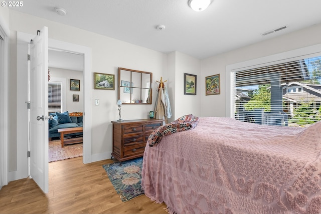 4604 SE 30th Ave, Portland, OR 97202 - bedroom with light wood-type flooring and baseboards