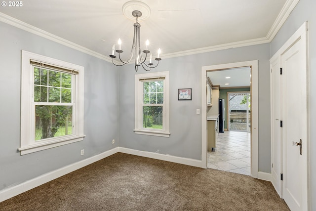 unfurnished room with healthy amount of natural light, a chandelier, carpet, and ornamental molding