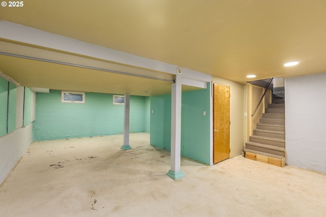 finished below grade area with stairway and recessed lighting