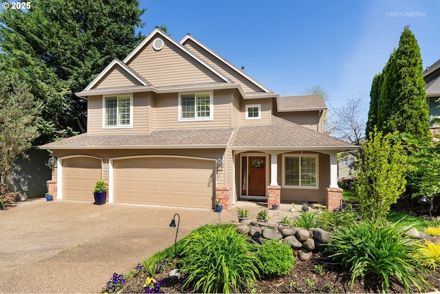 13829 SE Alta Vista Dr, Happy Valley, OR 97086 - view of front of property featuring a garage, driveway, a shingled roof, and covered porch