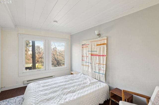 bedroom with hardwood / wood-style floors, wood ceiling, and baseboard heating