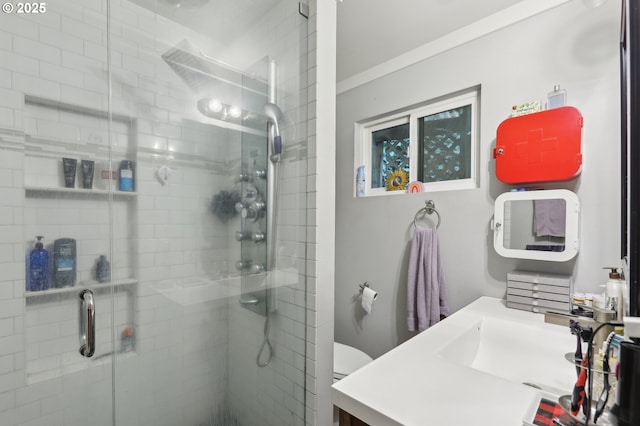 bathroom with vanity, an enclosed shower, and toilet