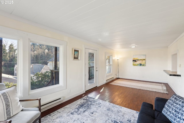 living room with dark hardwood / wood-style flooring, a baseboard radiator, and ornamental molding