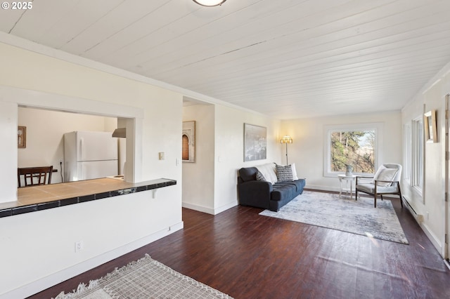 living room featuring dark wood-type flooring and ornamental molding