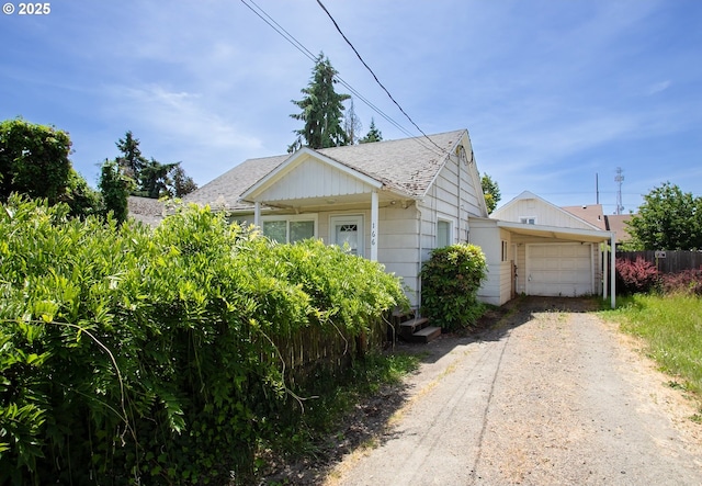 166 Iowa St, Eugene, OR 97402 - view of front of home with driveway, a garage, and a shingled roof