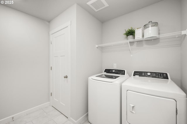 5603 Edward Ct SE, Albany, OR 97322 - laundry room featuring separate washer and dryer and light tile patterned flooring