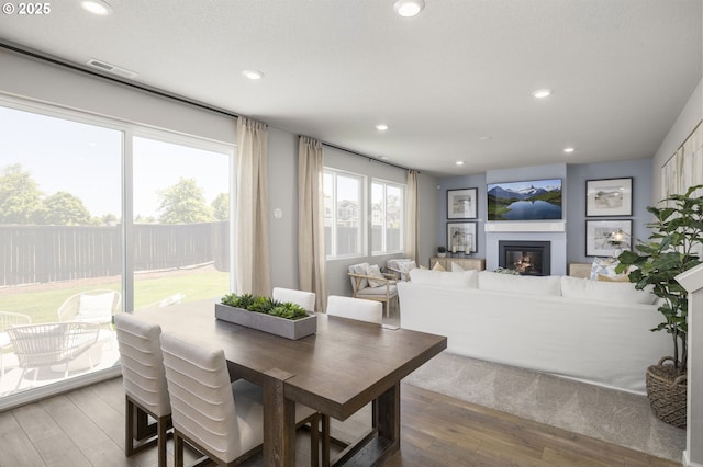 5603 Edward Ct SE, Albany, OR 97322 - dining room with wood finished floors, recessed lighting, and a glass covered fireplace