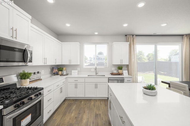 5603 Edward Ct SE, Albany, OR 97322 - kitchen with stainless steel appliances, plenty of natural light, recessed lighting, light countertops, and white cabinetry