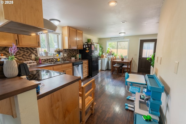 1727 E Washington Ave, Cottage Grove, OR 97424 - kitchen featuring freestanding refrigerator, separate washer and dryer, dark countertops, dishwasher, and decorative backsplash