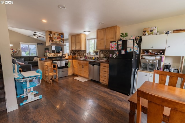 1727 E Washington Ave, Cottage Grove, OR 97424 - kitchen featuring stainless steel appliances, healthy amount of natural light, dark countertops, dark wood-style flooring, and recessed lighting
