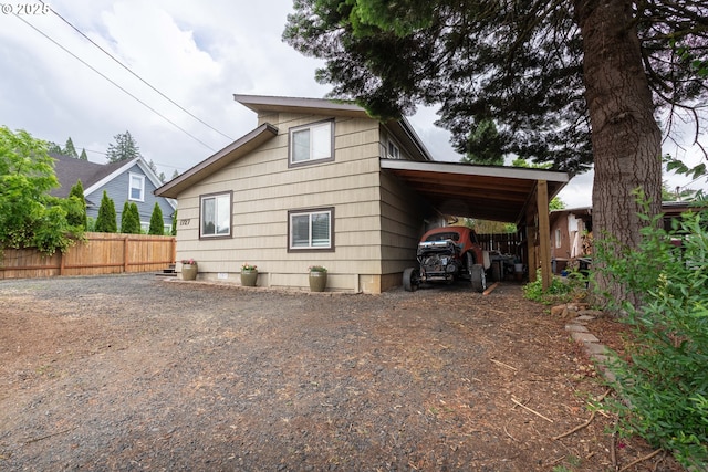 1727 E Washington Ave, Cottage Grove, OR 97424 - view of home's exterior featuring dirt driveway and an attached carport