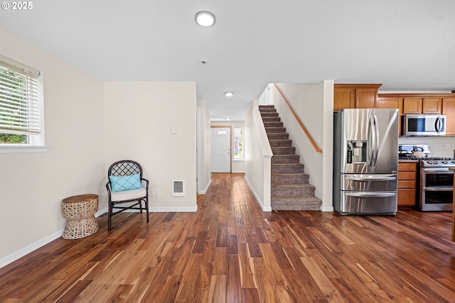 1225 3rd Ave, Hammond, OR 97121 - unfurnished room with dark wood finished floors, stairs, baseboards, and recessed lighting