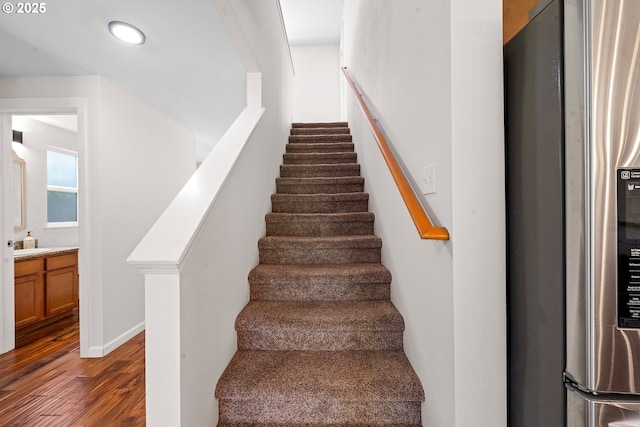 1225 3rd Ave, Hammond, OR 97121 - stairs featuring wood finished floors, recessed lighting, and baseboards