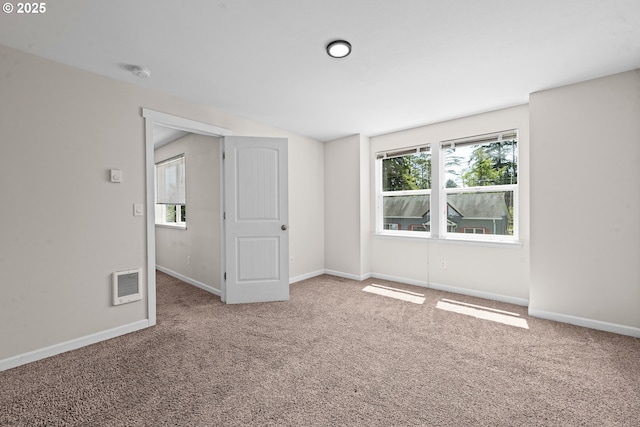1225 3rd Ave, Hammond, OR 97121 - spare room featuring carpet, baseboards, a smoke detector, and heating unit