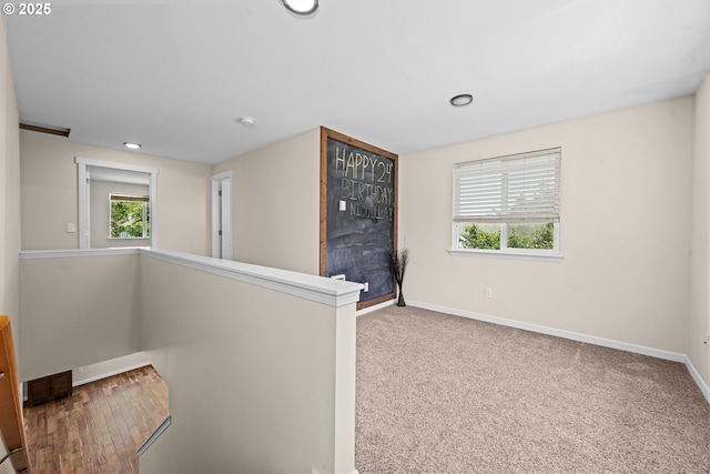 1225 3rd Ave, Hammond, OR 97121 - hallway featuring baseboards, recessed lighting, and an upstairs landing