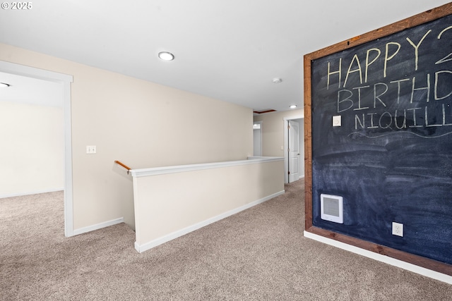 1225 3rd Ave, Hammond, OR 97121 - hallway with carpet floors, baseboards, recessed lighting, and an upstairs landing