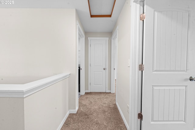 1225 3rd Ave, Hammond, OR 97121 - hallway with carpet flooring, baseboards, and attic access