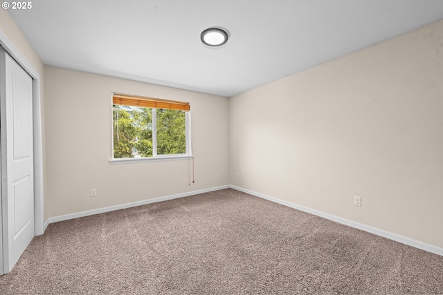 1225 3rd Ave, Hammond, OR 97121 - unfurnished bedroom with carpet, baseboards, and a closet