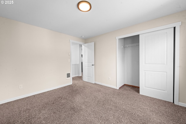 1225 3rd Ave, Hammond, OR 97121 - unfurnished bedroom featuring carpet floors, baseboards, and a closet