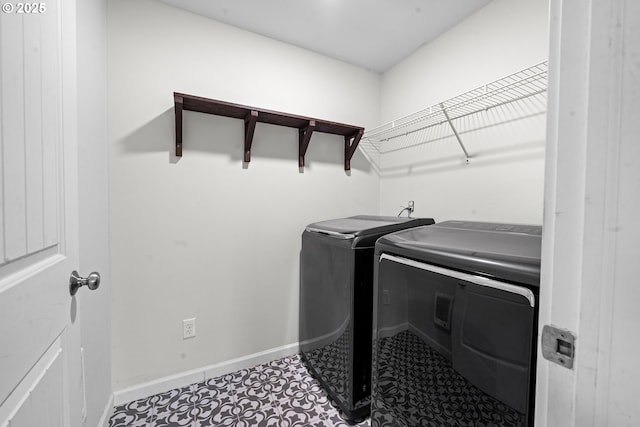 1225 3rd Ave, Hammond, OR 97121 - laundry area featuring separate washer and dryer and baseboards