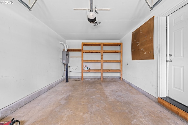 1225 3rd Ave, Hammond, OR 97121 - garage featuring tankless water heater, a garage door opener, and baseboards