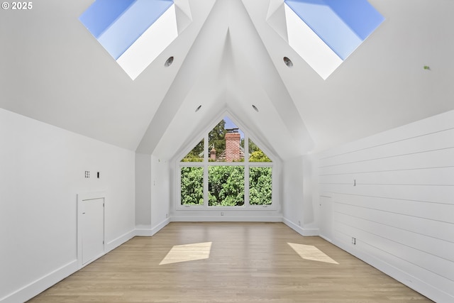 12643 S Iron Mountain Blvd, Portland, OR 97219 - additional living space with a skylight, light wood finished floors, vaulted ceiling, and baseboards