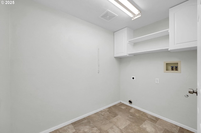 laundry area featuring cabinets, hookup for a washing machine, and hookup for an electric dryer