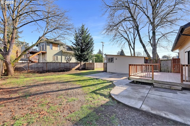 view of yard featuring a deck and a patio area