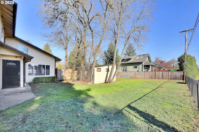 view of yard with a storage unit