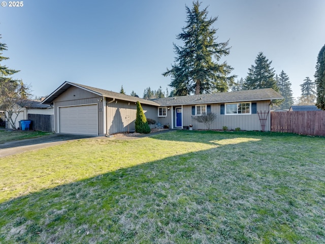 ranch-style home with a garage and a front yard