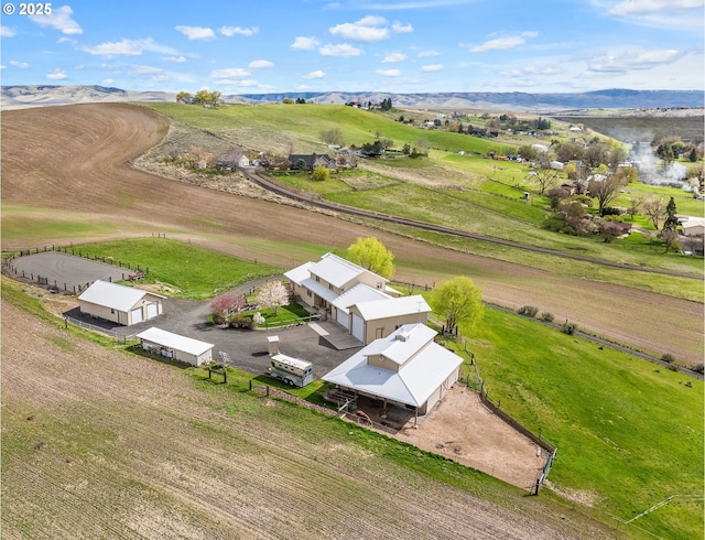 aerial view featuring a mountain view and a rural view