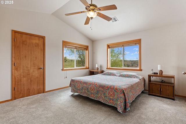 bedroom featuring visible vents, baseboards, carpet flooring, and lofted ceiling