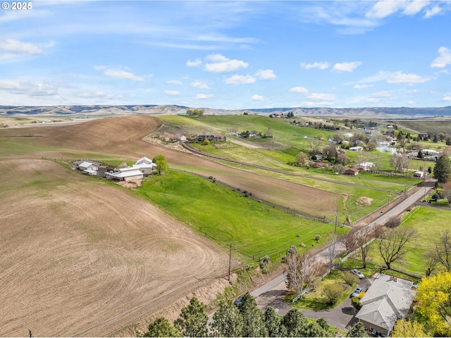 drone / aerial view with a rural view and a mountain view